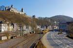   Eine Stopfmaschine und eine Schotterplaniermaschinen der DGU - Deutsche Gleisbau Union (Koblenz), fahren am 08.03.2014 über die Ruhr-Sieg-Strecke (KBS 440) durch Altena in Richtung Kreuztal.