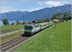 Kurz vor der Statin Faulensee ist die SBB RE 4/4 II 502 mit ihrem RE nach Zweisimmen unterwegs.