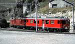 RhB ABe 4/4 Nr.56 vor dem nächsten Zug vorgehängt an Gem 4/4 Nr.801 und ABe 4/4 Nr.41 in Alp Grüm im August 1990.