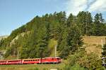 RhB Ge 4/4 II Nr.618 mit Personenzug bei Madulein am 28.08.2009.